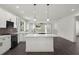 Well-designed kitchen featuring a central island, stainless appliances, and an integrated open layout at 5709 N 20Th St, Tampa, FL 33610