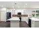 Contemporary kitchen with a large island, stainless steel appliances, and white cabinets at 5709 N 20Th St, Tampa, FL 33610