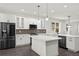 Spacious kitchen with an island, stainless steel appliances, and abundant storage space at 5709 N 20Th St, Tampa, FL 33610