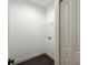 Bright laundry room features shelving and hardwood floors at 5709 N 20Th St, Tampa, FL 33610