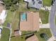 Aerial view of home featuring a screened-in pool and well-manicured lawn at 6236 17Th S St, St Petersburg, FL 33712