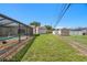 Backyard with a screened-in lanai providing an outdoor living area at 6236 17Th S St, St Petersburg, FL 33712