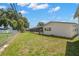 Spacious backyard featuring a screened-in pool and ample green space at 6236 17Th S St, St Petersburg, FL 33712