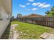 Spacious backyard with a wooden fence, offering privacy and ample space for outdoor activities at 6236 17Th S St, St Petersburg, FL 33712
