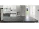 Clean kitchen featuring stainless steel appliances and dark countertops offer a modern aesthetic at 6236 17Th S St, St Petersburg, FL 33712