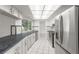 Bright kitchen boasts stainless steel appliances, white cabinets, and lots of counter space at 6236 17Th S St, St Petersburg, FL 33712