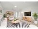 Stylish living room with modern decor, a zebra rug, and ample seating space at 6236 17Th S St, St Petersburg, FL 33712