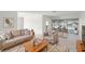 Cozy living room featuring neutral tones, comfortable seating, and an adjacent dining area with pool view at 6236 17Th S St, St Petersburg, FL 33712