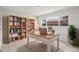 Stylish home office features a large window, built-in bookcase and modern desk perfect for working from home at 6236 17Th S St, St Petersburg, FL 33712