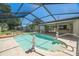 Screened-in pool area featuring decorative seahorse statues and clear water at 6236 17Th S St, St Petersburg, FL 33712