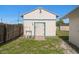Exterior of a white shed with a charming blue trim and a simple door at 6236 17Th S St, St Petersburg, FL 33712
