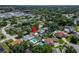 A captivating aerial view of a charming single-Gathering home, showcasing its inviting pool and lush greenery at 6554 34Th N Ave, St Petersburg, FL 33710