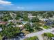 Scenic aerial view of a community, highlighting quiet residential streets, verdant trees, and a mix of commercial properties at 6554 34Th N Ave, St Petersburg, FL 33710