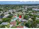 Overhead shot of a neighborhood near commercial zones, easily found thanks to a noticeable red marker at 6554 34Th N Ave, St Petersburg, FL 33710