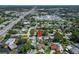 Comprehensive aerial view of a community close to industrial sectors, marked by a distinguishing red pin at 6554 34Th N Ave, St Petersburg, FL 33710
