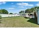 Backyard featuring a well-manicured lawn, patio area, storage shed, and fenced perimeter at 6554 34Th N Ave, St Petersburg, FL 33710