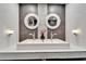 Bright bathroom featuring double vanity, matching mirrors, and decorative vase at 6554 34Th N Ave, St Petersburg, FL 33710