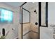 Bathroom boasting walk-in shower and neutral color tiles, a rain shower head, and a plant at 6554 34Th N Ave, St Petersburg, FL 33710
