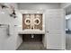 Bathroom features double sinks, tiled floor, and decoratively lit mirrors at 6554 34Th N Ave, St Petersburg, FL 33710