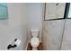 Bathroom featuring a modern commode, neutral tones and updated modern walk-in shower at 6554 34Th N Ave, St Petersburg, FL 33710