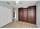 Bedroom with built-in bookcases, closet, and hard surface flooring at 6554 34Th N Ave, St Petersburg, FL 33710