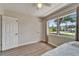 Light-filled bedroom with a large window and hardwood floors at 6554 34Th N Ave, St Petersburg, FL 33710