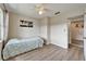 Cozy bedroom with light walls, ceiling fan, and bright natural light at 6554 34Th N Ave, St Petersburg, FL 33710