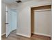 Spacious closet with white door, overhead shelf, and new looking wood-look flooring at 6554 34Th N Ave, St Petersburg, FL 33710