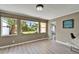Bright dining area featuring multiple windows, modern flooring, and neutral paint at 6554 34Th N Ave, St Petersburg, FL 33710