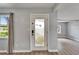 Welcoming entryway with decorative glass door, natural light, and wood-look flooring at 6554 34Th N Ave, St Petersburg, FL 33710