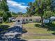 Single Gathering home with a lawn and mature trees in a residential neighborhood at 6554 34Th N Ave, St Petersburg, FL 33710