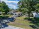 A cozy single-story home with a well-manicured lawn and a driveway at 6554 34Th N Ave, St Petersburg, FL 33710