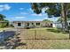 Charming home with lush lawn and a protective chain link fence at 6554 34Th N Ave, St Petersburg, FL 33710