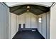 Spacious shed interior with a black rubber floor and ample space for storage at 6554 34Th N Ave, St Petersburg, FL 33710