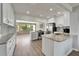 Modern kitchen with stainless appliances, white cabinets, and a functional island, perfect for entertaining at 6554 34Th N Ave, St Petersburg, FL 33710