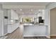 Updated kitchen with bright cabinets, stainless appliances, granite countertops, and great natural light at 6554 34Th N Ave, St Petersburg, FL 33710