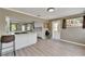 Open concept kitchen with counter seating, view into the dining and living room, plus stainless appliances at 6554 34Th N Ave, St Petersburg, FL 33710