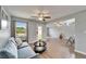Comfortable living room featuring modern decor, a ceiling fan, and a view of the outdoors at 6554 34Th N Ave, St Petersburg, FL 33710