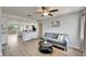 Inviting living space flowing into the open kitchen, featuring contemporary decor and wood-look floors at 6554 34Th N Ave, St Petersburg, FL 33710