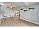 Open living space featuring hardwood floors, modern decor, and seamless flow into the adjacent kitchen at 6554 34Th N Ave, St Petersburg, FL 33710