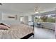 Beautiful main bedroom showcasing a large window, modern flooring, natural light, and a cozy seating area at 6554 34Th N Ave, St Petersburg, FL 33710