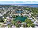 Stunning aerial view of a lakeside community with clear waters and beautiful homes at 6561 Exeter Ct, Seminole, FL 33772