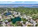 Expansive aerial view of a coastal community, featuring lush greenery and sparkling waterfronts at 6561 Exeter Ct, Seminole, FL 33772