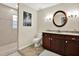Bathroom featuring a granite countertop, and tiled shower at 6561 Exeter Ct, Seminole, FL 33772