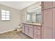 This bathroom boasts a granite countertop, providing a touch of elegance and durability at 6561 Exeter Ct, Seminole, FL 33772