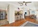Open kitchen with stainless steel appliances, breakfast bar, and hardwood floors, perfect for entertaining at 6561 Exeter Ct, Seminole, FL 33772