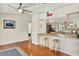 Inviting kitchen and breakfast bar featuring light-colored cabinets and granite countertops, perfect for casual dining at 6561 Exeter Ct, Seminole, FL 33772