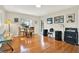 Well lit living room with hardwood flooring at 6561 Exeter Ct, Seminole, FL 33772