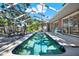 Backyard with a screened-in pool and outdoor seating and dining space at 6561 Exeter Ct, Seminole, FL 33772