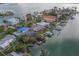 Aerial view of a waterfront neighborhood, showcasing boat docks and serene canal views at 735 123Rd Ave, Treasure Island, FL 33706